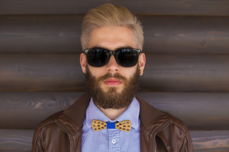 Simple portrait of a genuine hipster with original cool style.の写真素材