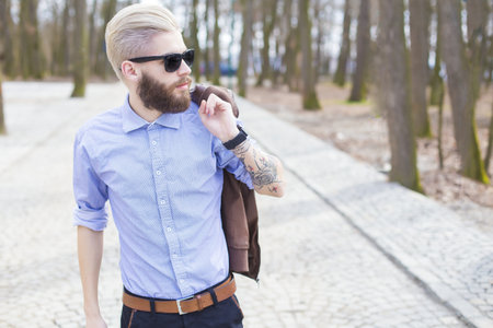 Fashionable young man representing the new generation's hipster style.の写真素材