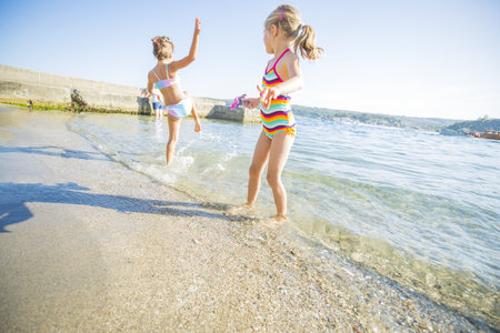 Children playing in the waterの写真素材