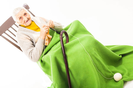 Old woman resting on the rocking chairの写真素材