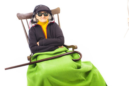 Cool old woman with sunglasses and hat.の写真素材