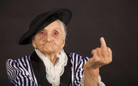 Old grandma in a white-black striped jacketの写真素材
