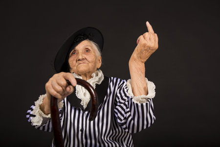 Old grandma in a white-black striped jacketの写真素材