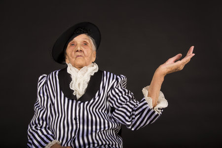 Old grandma in a white-black striped jacketの写真素材