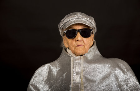 vintage old woman in glitter with headphone