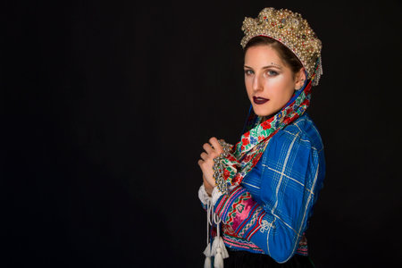 young brunette in folk clothes and pearl corollaの写真素材