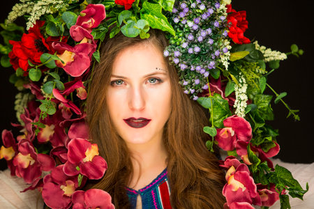 young fairy woman with flowers on her headの写真素材
