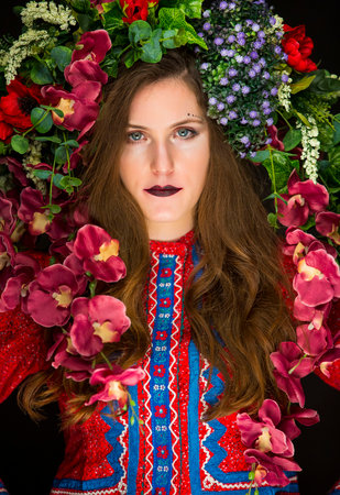 young fairy woman with flowers on her headの写真素材