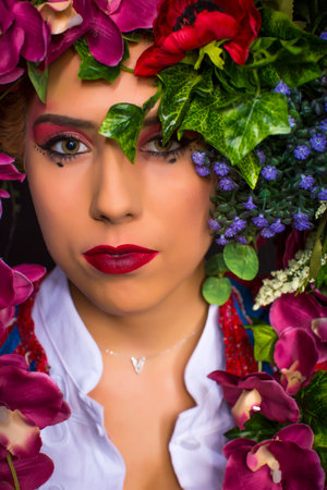 young fairy woman with flowers on her headの写真素材
