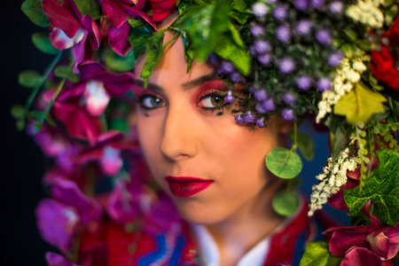 young fairy woman with flowers on her headの写真素材