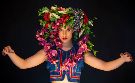 young fairy woman with flowers on her headの写真素材