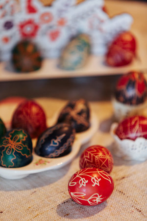 A collection of intricately decorated Easter eggs, showcasing traditional folk art patterns and...