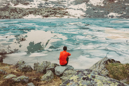 Man in front of a frozen lake