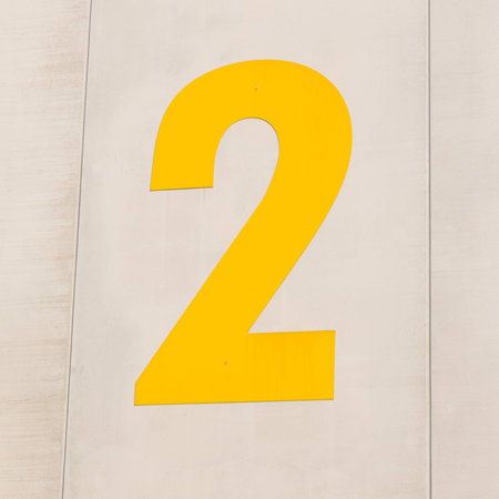 gray warehouse entrance number twoの写真素材