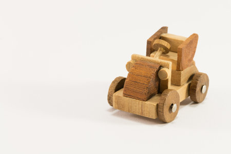 Wooden toy old car miniature isolated on white backgroundの写真素材