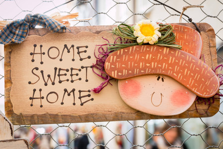 sweet home decoration hanged on wire meshの写真素材