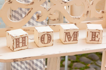 wooden old-looking cube decoration: home lettersの写真素材