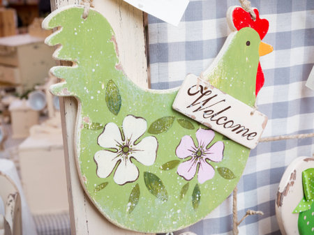 Hanged green wooden decoration chicken shaped: welcome lettersの写真素材