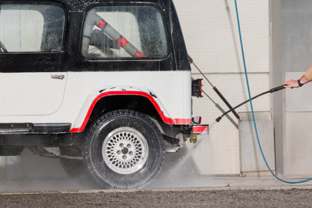 car wash with a jet of water and shampooの写真素材