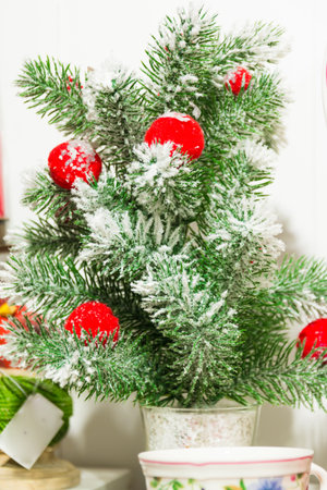 little plastic christmas tree with red ballsの写真素材