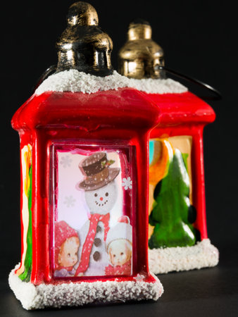 vintage red christmas lanterns with snowman and children pictureの写真素材