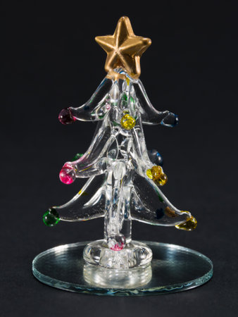glass christmas tree over black backgroundの写真素材