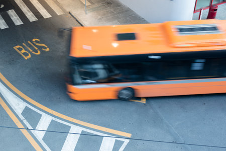 bus in blurred motion on city streetの写真素材