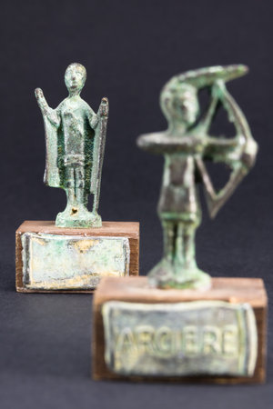 archer bronze statuette and chieftain praying with cloak and stick fgurineの写真素材