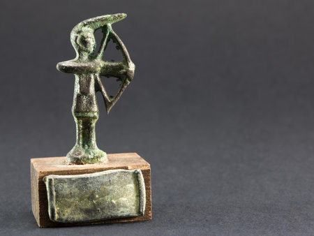 archer bronze figurine, arrow and bow statuetteの写真素材
