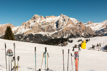 Ski poles sticked in the snowの写真素材