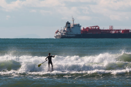 Stand up paddle board, man paddleboarding on red board
