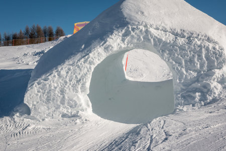 frozen tunnel, snowpark in dolomites mountains, the alpsの写真素材