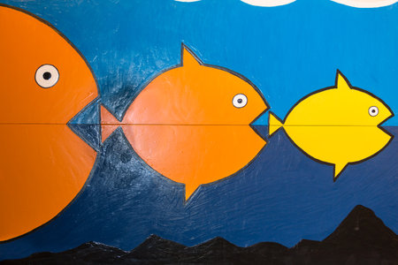 Painting of three Fishes predators devour each otherの写真素材