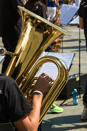 Little Boy with White Hat and Brass Lacquered Trumpet during Outdoor Concertの写真素材