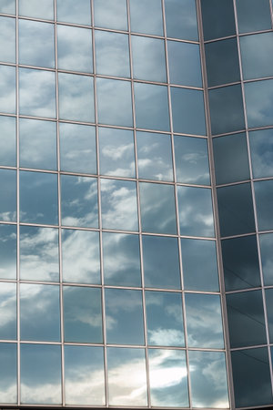 Blue Sky and Clouds Reflected in the Glass Building