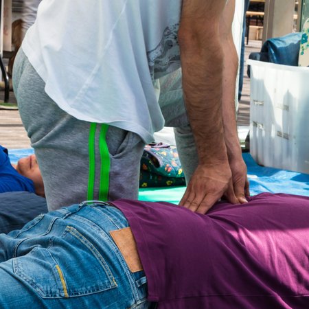 Elderly Man receiving Professional Massage by Therapist