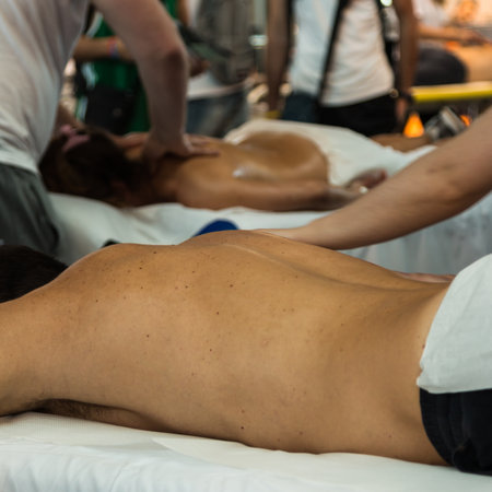 Chiropractor doing Manual Adjustment on Athletic Man'Shoulder after Sport Activity