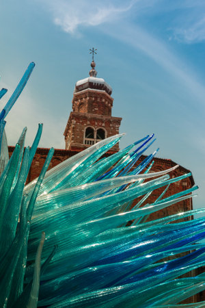 Detail of Blue Murano Glass Sculpture in Murano with San Giacomo Church in Background, Venice - Italyの写真素材