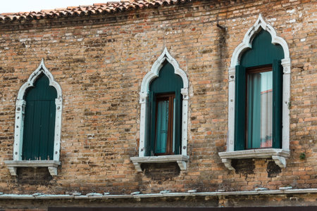 Windows and Brick Wall Facade in Murano Isle near Venice, Italyの写真素材