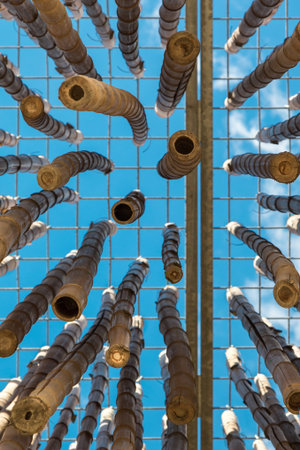 Hanging Bamboo Canes Close Each Other, Blue Sky in background at Milan Exposition 2015 - Italy