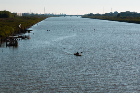 Silhouette of Canoes Competition on the River