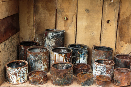 Rusted Aluminum Cans inside Wooden Containerの写真素材
