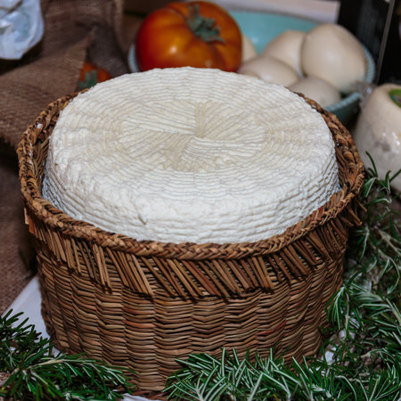 Soft White Italian Cheese, Ricotta in Circular Wicker Boxの写真素材