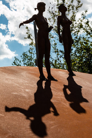 Bronze statue's Shadows and Silhouettes: Feminine Naked Body