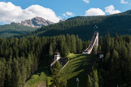 Abandoned Ski Jumping Trampoline among Mountains Scenery in Summer Timeのeditorial素材