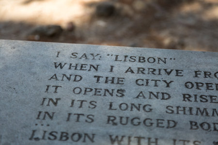 Close-up of Poem Engraved on Bench inside Castle of Sao Jorge in Lisbon, Portugal