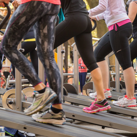 Women in Sportswear Exercising Outdoor on Treadmills