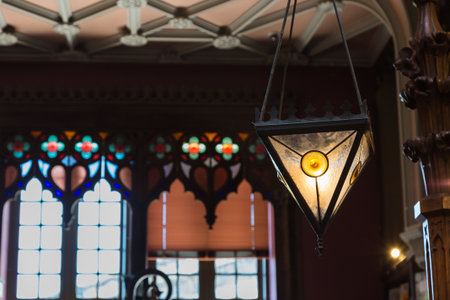 Antique Colorful Glass Chandelier in Bookshop and Large Windows in background
