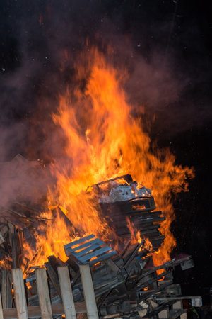 Big Wood Campfire with High Flames at Nightの写真素材