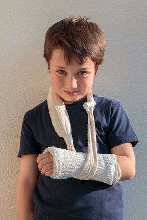 Little Caucasian Boy  with Broken Armの写真素材